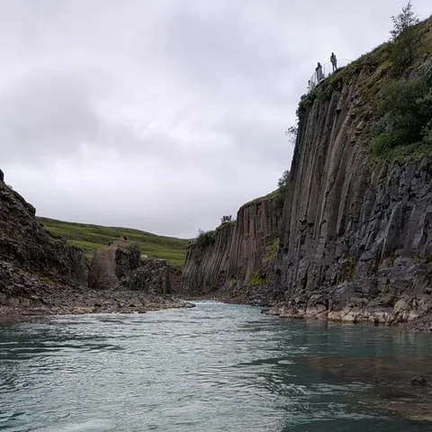 Basalt walls of the canyon above the glacial river