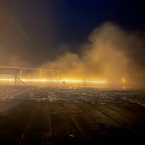 Steam rising from the geothermal pools at dusk